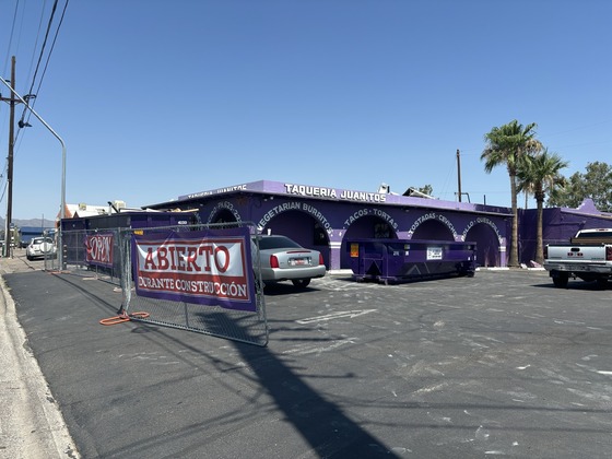 Photo of the famous purple exterior of Taqueria Juanitos, under construction for the next few months.
