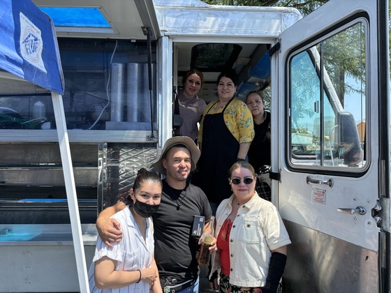 Photo Monica and Juanito Suazo, along with several Juanitos employees with the temporary food truck in the parking lot.