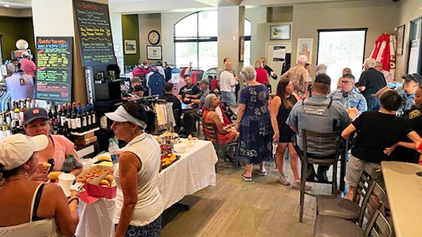 A crowded coffee shop with residents and TPD personnel.