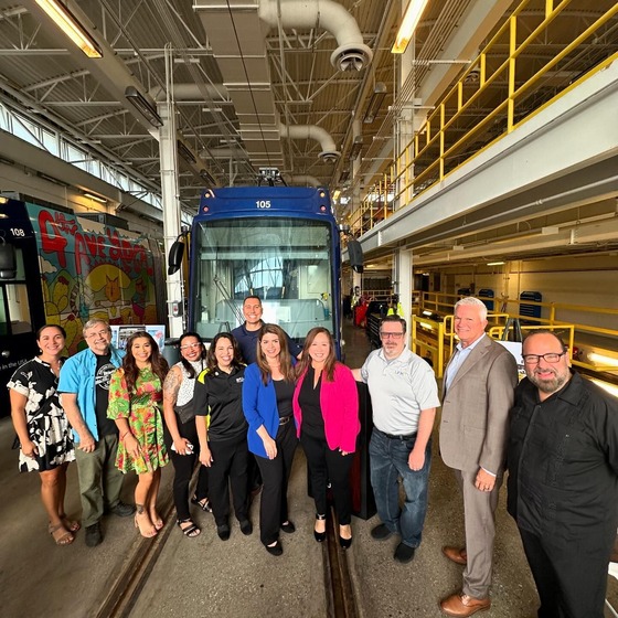 Photo Vice Mayor Dahl and the rest of the DTM folks standing in front of a street car.
