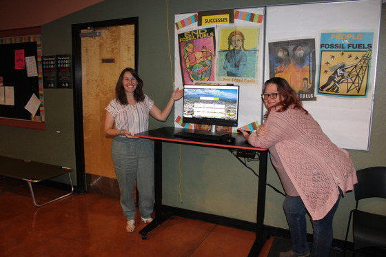 photo of Office Administrator Shannon Jenkins & St. Francis Shelter Community Cooling Center Manager Angela Murphy at the computer kiosk.