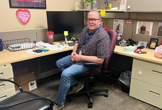Photo of Jeffrey Faircloth at his desk in the Community Safety Hub.