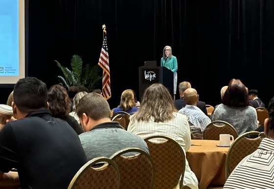 Photo of Governor Katie Hobbs addressing the housing conference