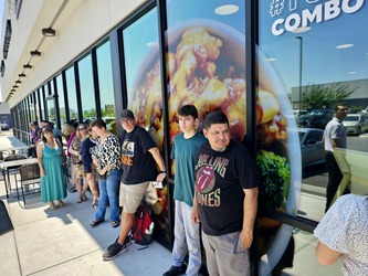 Picture of folks standing in line waiting to place their order
