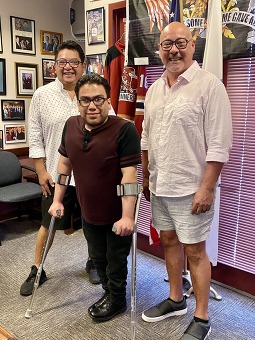 Photo of Che Café Owners with Aide, Gabe Holguin