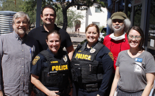 Photo of TPD Captain Adam Kidd with Vice Mayor Dahl and staff.