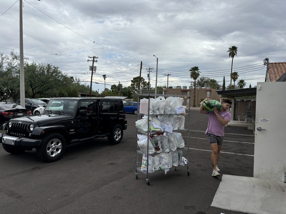 photo of Volunteers loading food and supplies for students.