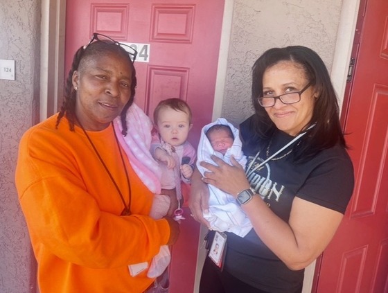 photo of Sonya holding Baby Alice and Brandi holding Wildcat Baby #2!