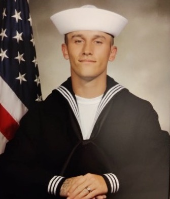 photo of Cole in his Navy blues after graduating.