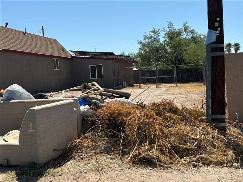 photo of More brush and bulky material on the side of the road.