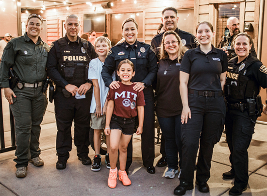 ODE members in uniform at the Tip a Cop Special Olympics fundraiser.