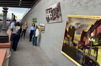 Examples of proposed art for the underpass being looked at and discussed by community members.