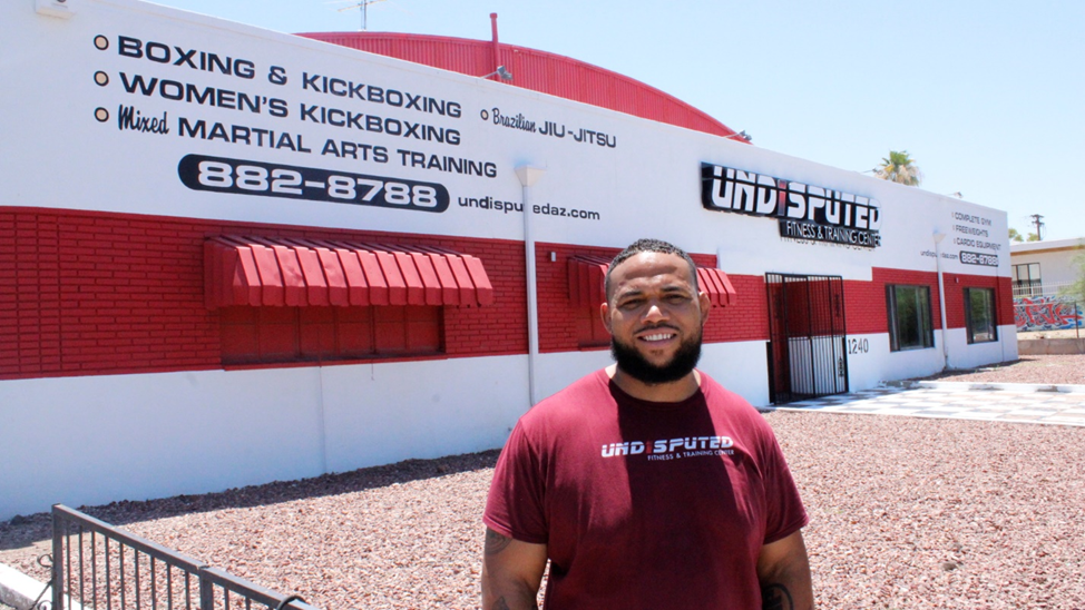 Photo of The exterior of the Undisputed Gym and owner John Moore.