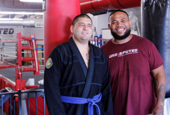 Photo of Brandon Salinas and John Moore after a Brazilian Jiu-Jitsu lesson.