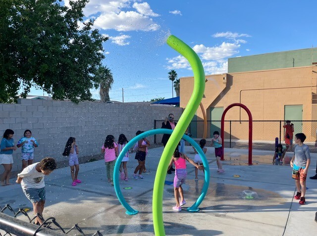 kids splashing in splash pad