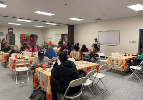 Photo of Neighbors gathering for Thanksgiving dinner at the Marty Birdman Center.