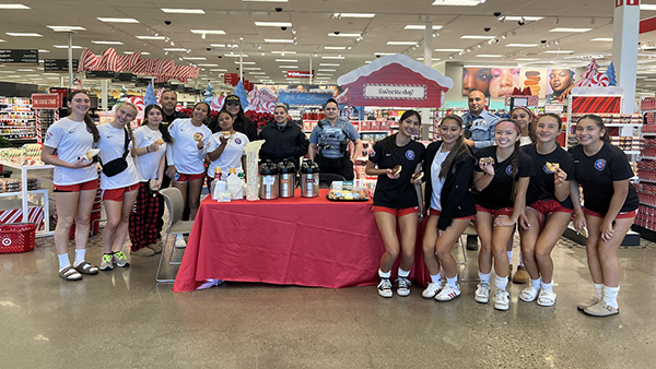 Department members and community members pose for a group photo inside Target.