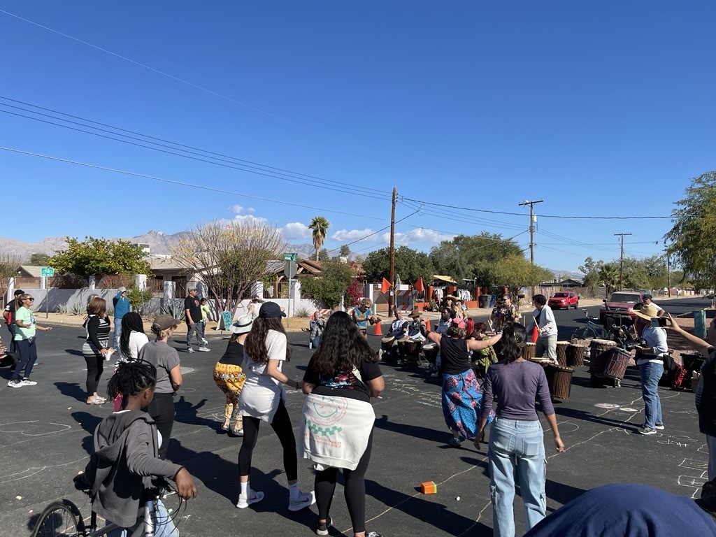 Photo of Neighbors dancing along to an African drumming performance by King-Doumbya Drumming and Dance group. 
