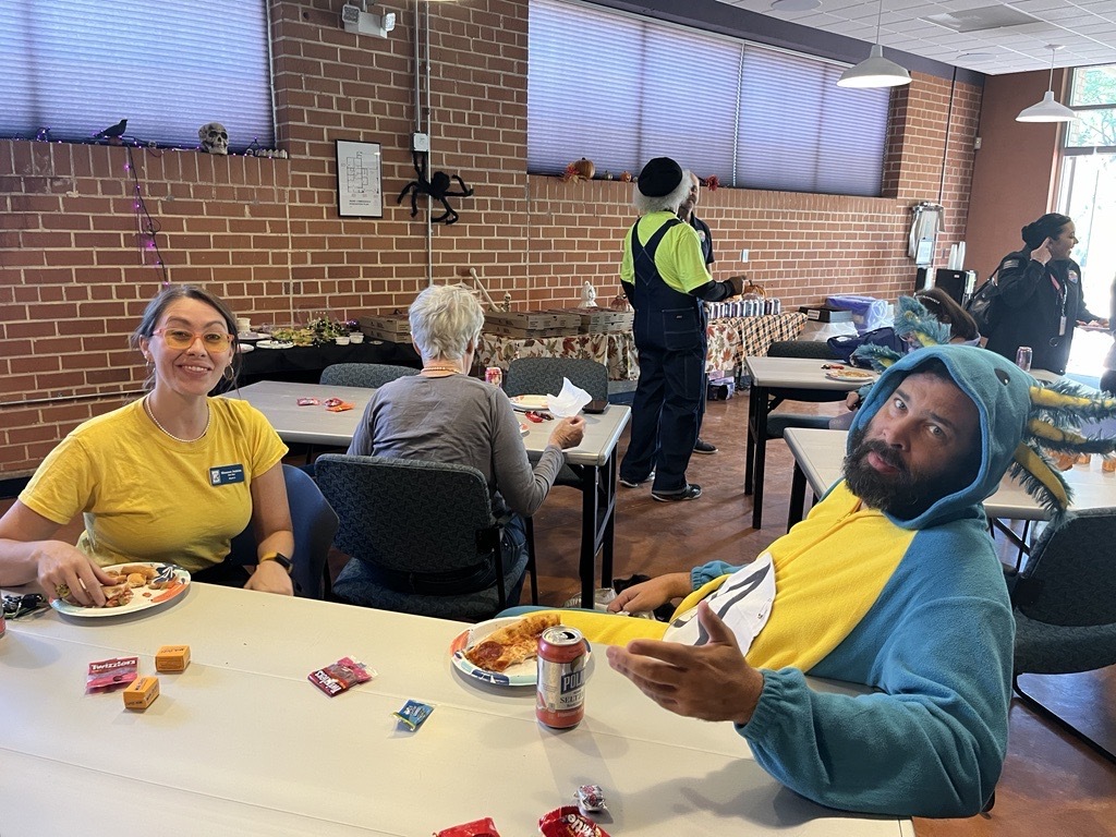 Photo of Ward 3 Staff Shannon Jenkins and CJ Boyd in costume at the Ward 3 Halloween party.