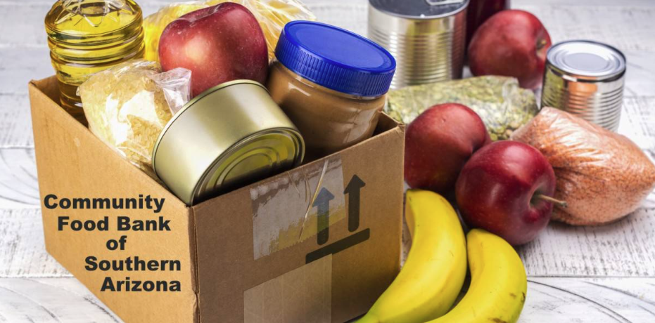 Picture of Food Bank box with canned food and fruit in it 