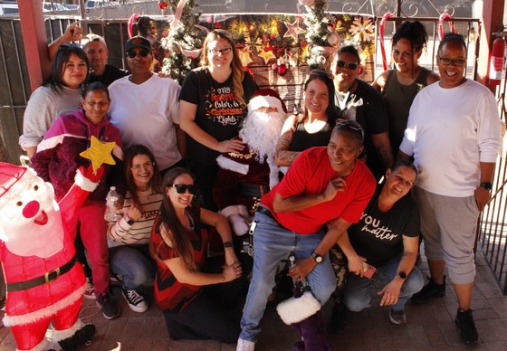 Photo of the Housing First staff take their turn with Santa!