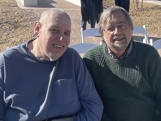 Photo of John and Council Member Dahl waiting to begin the ribbon cutting.