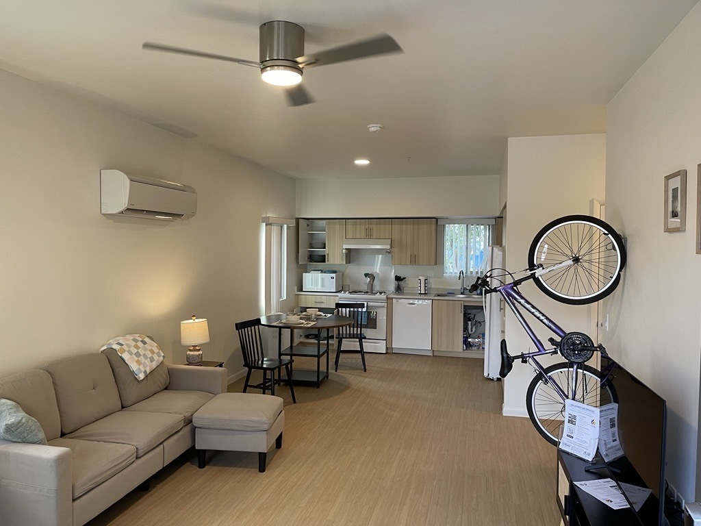 photo of Living room and kitchen of a two-bedroom apartment.