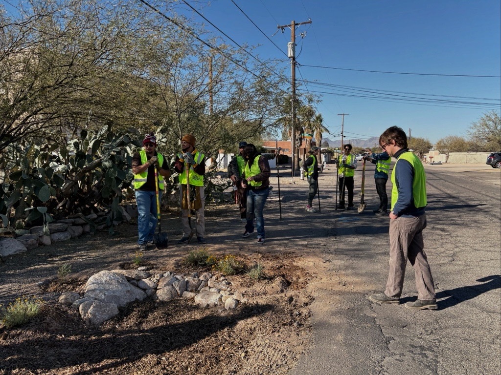 photo of a newly installed basin as the planting wraps up. 