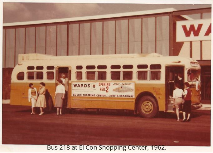 Sun Tran bus with women outside of it. 