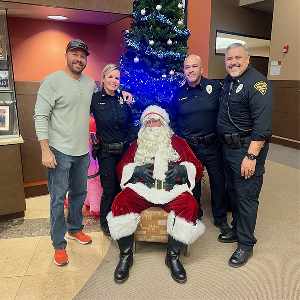 ODW leadership staff pose for a group photo with Santa.
