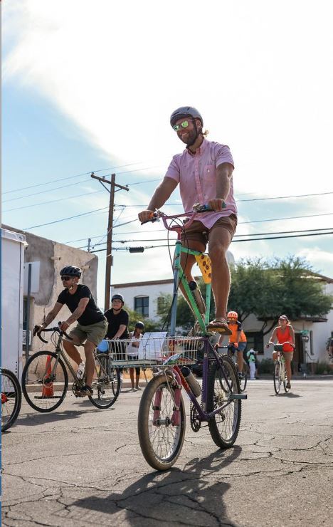 Cyclovia picture of a guy riding his lifted bicycle
