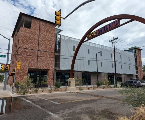 Picture of a three story building next to street