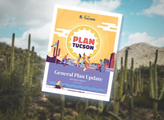Picture of a book labeled Plan Tucson with Saguaros in the background