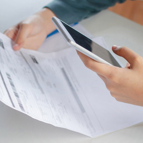 photo of person paying a bill