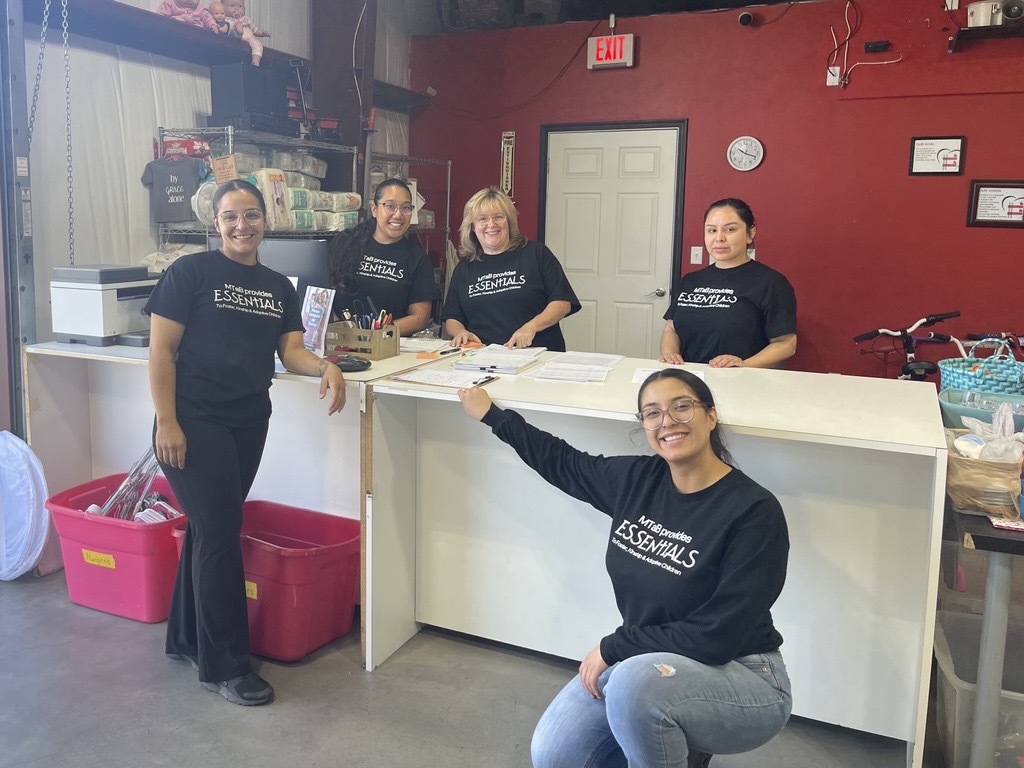 Photo of Some of the employees who work in the retail portion of the warehouse. 