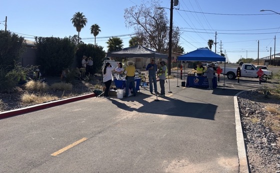 Photo of the storm to shade crew working on the landscape at 11th and Flores.