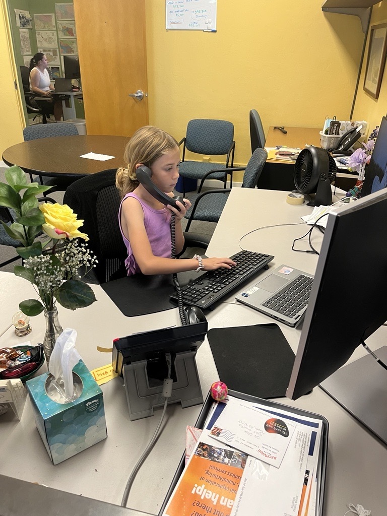 Photo of young girl sitting at Shannon Jenkins' desk