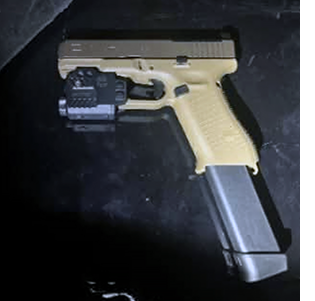 Handgun with an extended high capacity magazine.