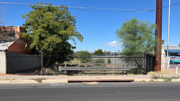 Photo showing fenced-off wash.