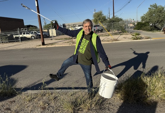 Photo of Council Member Kevin Dahl having fun picking up litter on Grant Road.