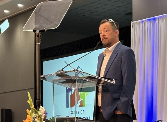 Photo Of Tucson Poet Laureate T.C. Tolbert reciting his poem: At the Base of the Black Hill: What We Share, What We Carry.