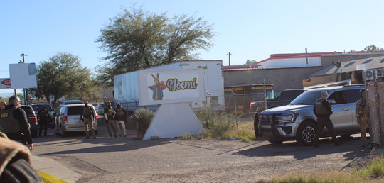 Photo of The entrance of Noemi Trucking with heavily armed Federal Agents standing guard.