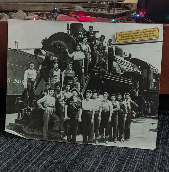 Vintage photo of train surrounded by women