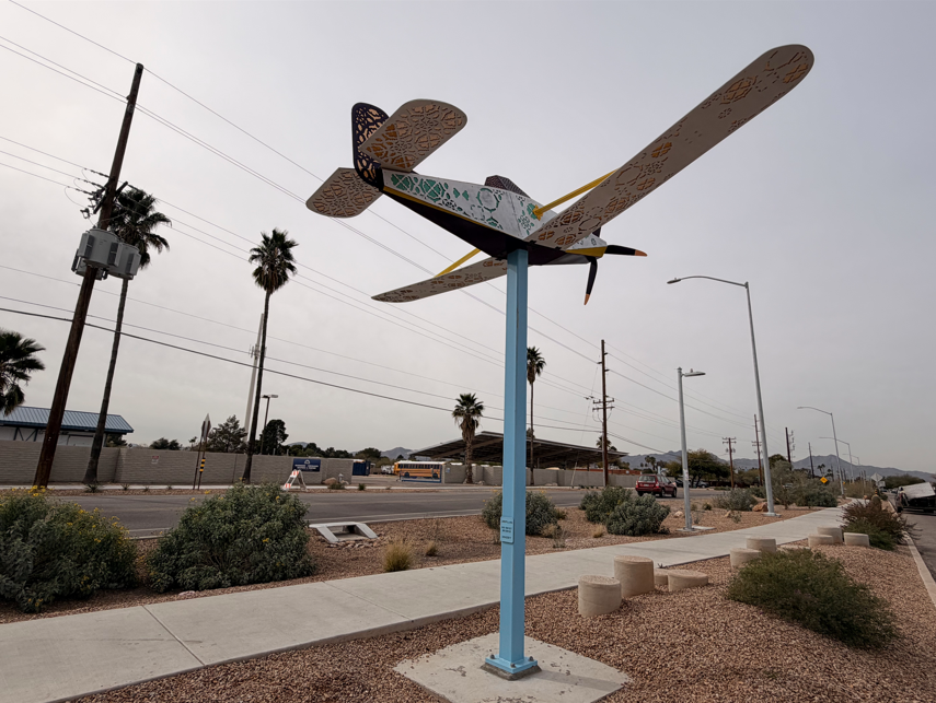 Photo of one of the airplane sculptures along the walking path.