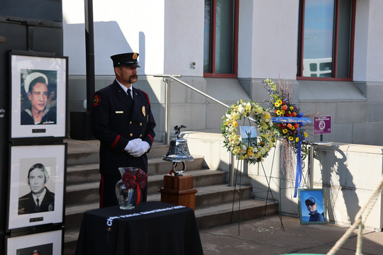 Wreaths of flowers and photographs of Fallen Firefighters at the Memorial Ceremony