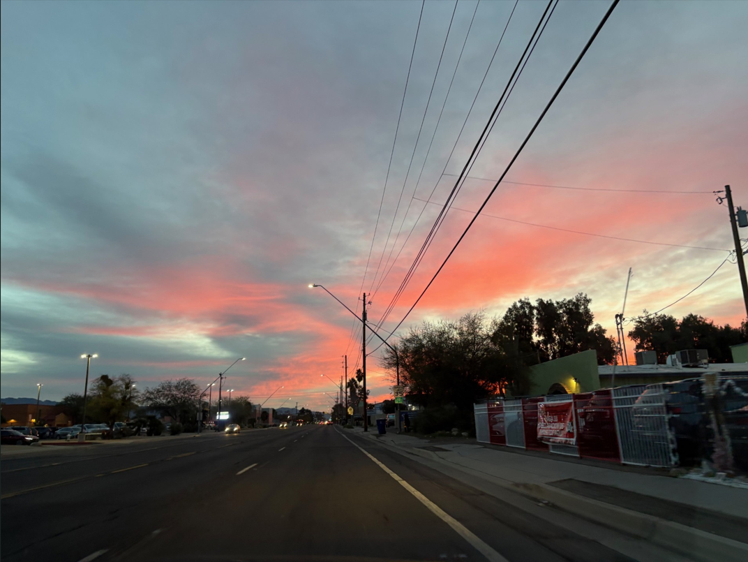 Photo of a pinkish sunrise over Tucson.