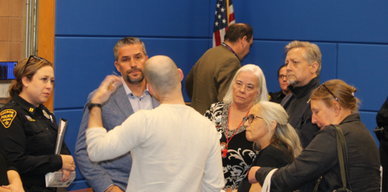 Photo of Tucson Police Chief Chad Kasmar answering questions during a community meeting.