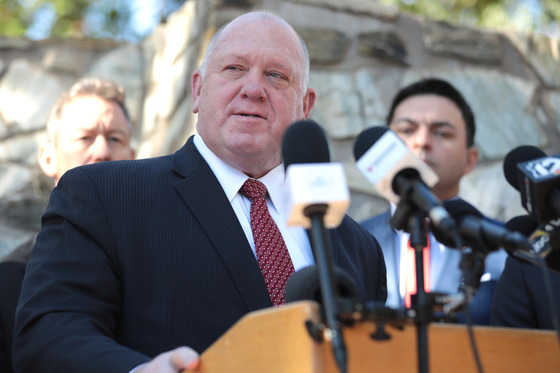 Photo of United States border czar Tom Homman Giving a speech at a podium.