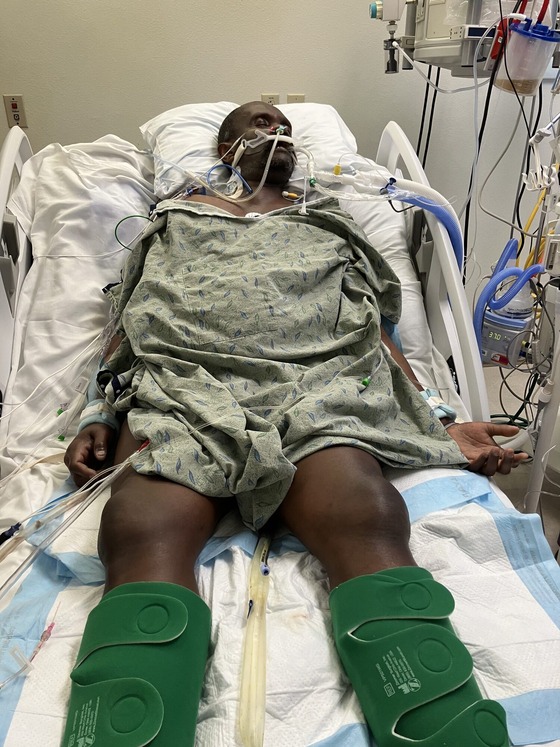 Photo of Emmanuel Damas in hospital bed