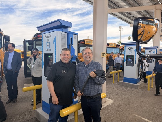 Photo of Council Member Dahl with Ken Bolle at a charging station. 